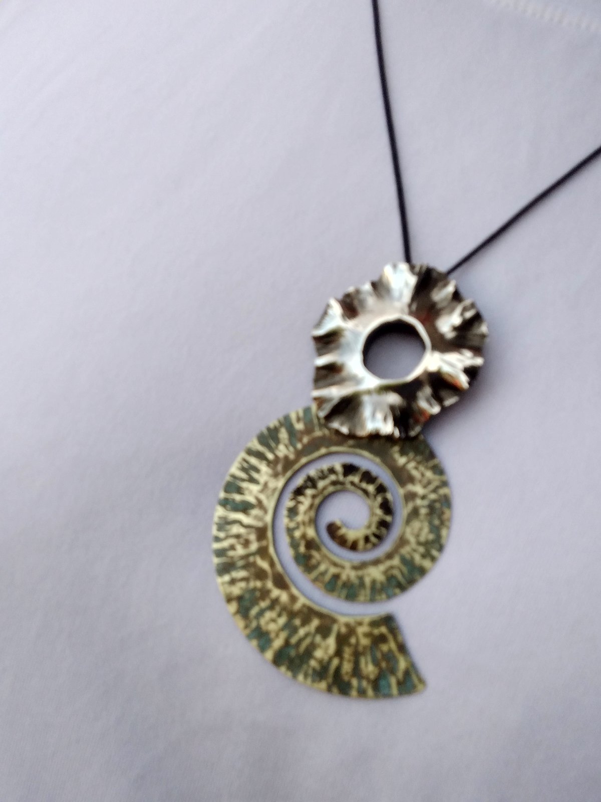 Spiral and radial pendants